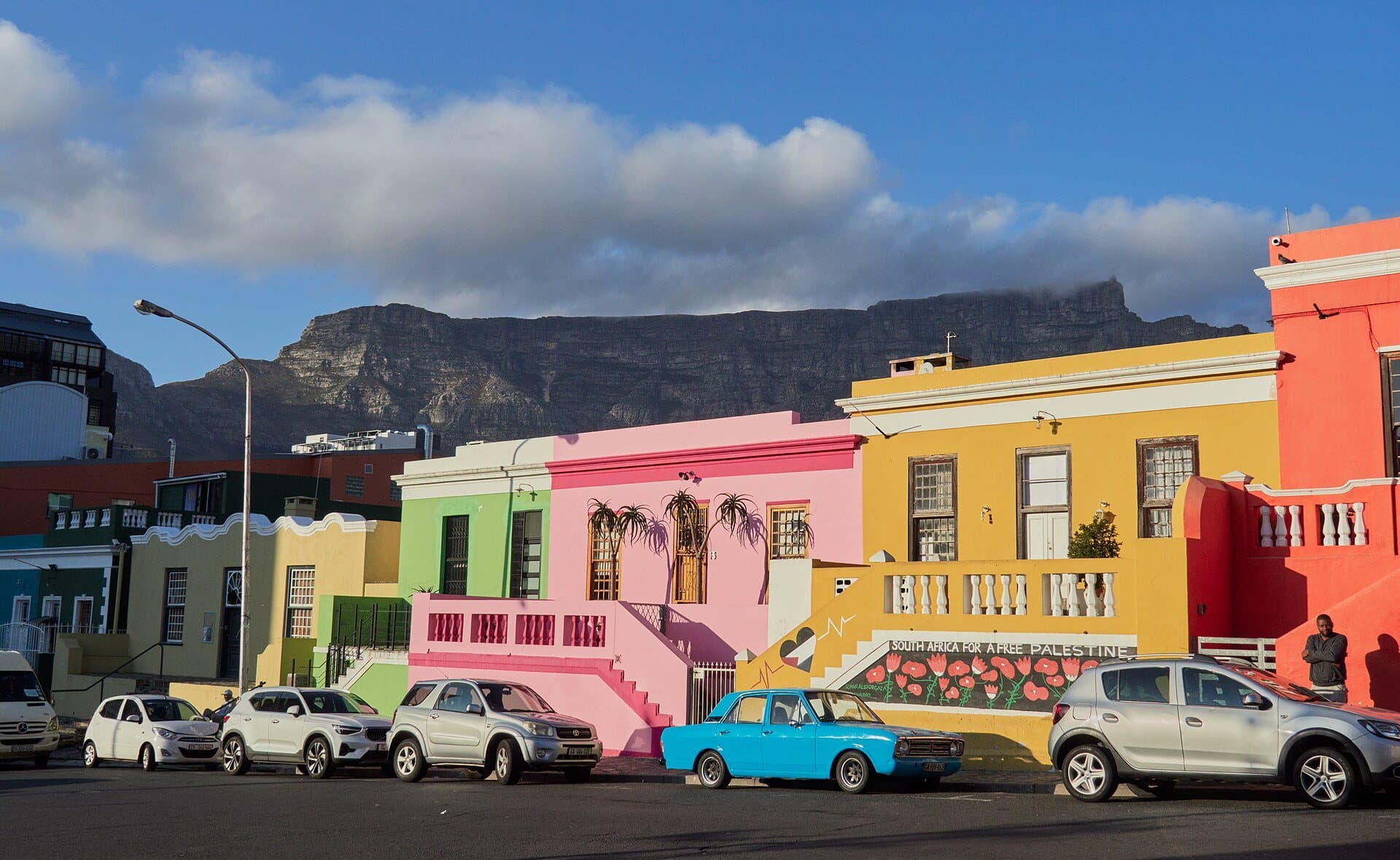 Brightly painted terraced houses in the Bo-Kaap, with Table Mountain behind